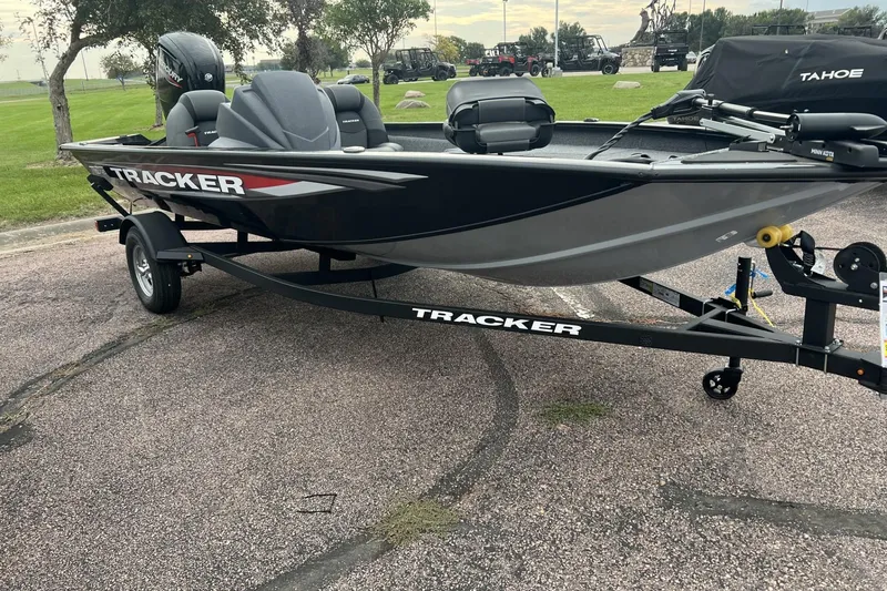 The Image of 2026 Tracker Pro Team 175 boat on trailer, parked outdoors. - 0