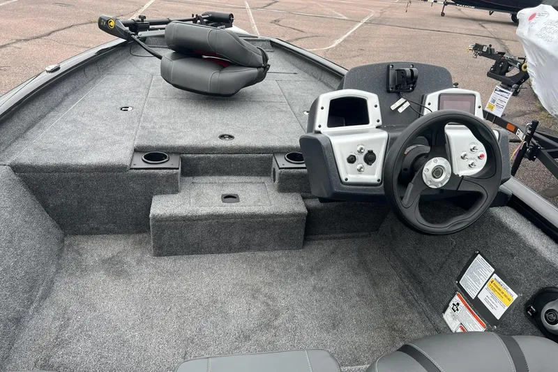 Slide: The Image of 2026 Tracker Pro Team 175 boat interior with steering wheel and seating. - 3