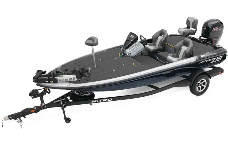 The Image of 2026 Nitro Z18 Pro boat on trailer, parked outdoors, with visible engine and seating. - 0