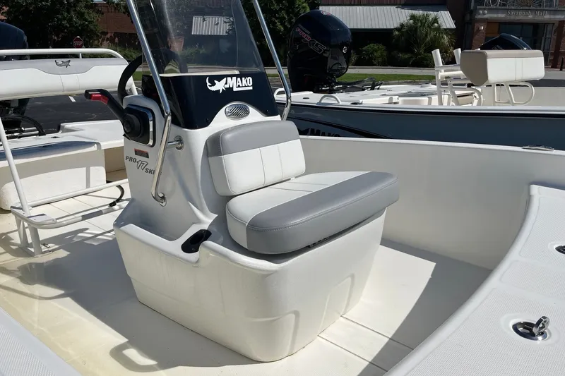 Slide: The Image of 2026 Mako Pro Skiff 17 CC boat interior with seating and console. - 9