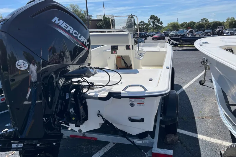 Slide: The Image of 2026 Mako Pro Skiff 17 CC boat with Mercury engine in parking lot. - 5