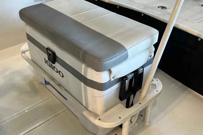 Slide: The Image of Cooler seat on 2026 Mako Pro Skiff 17 CC boat deck. - 17