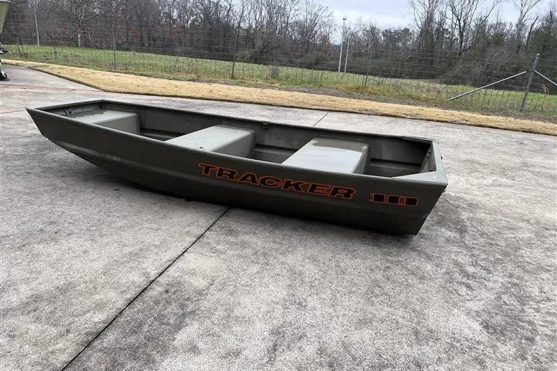Slide: The Image of 2026 Tracker Grizzly 10 Jon boat on concrete surface, outdoors. - 3