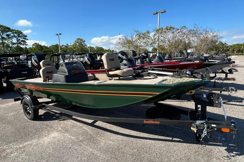 The Image of 2026 Tracker Bass Tracker Classic Limited boat in a parking lot under clear skies. - 0