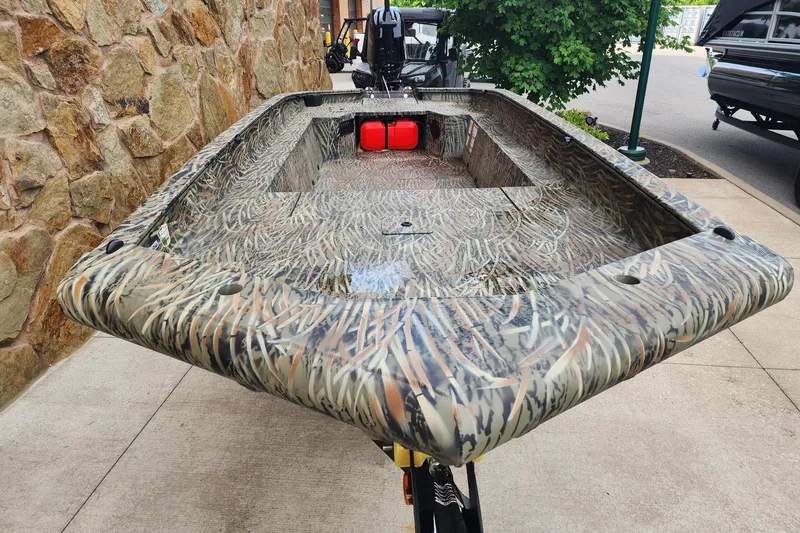 Slide: The Image of 2026 Tracker Grizzly 1650 T Prairie Wings Edition boat with camouflage design. - 34