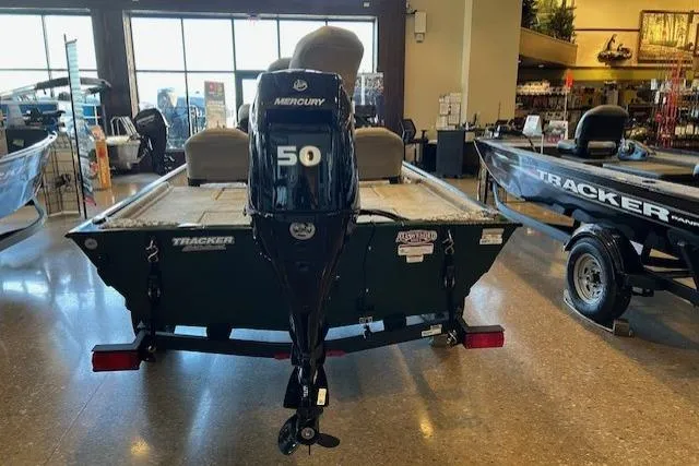 Slide: The Image of 2026 Tracker Bass Tracker Classic Limited boat with Mercury 50 engine in showroom. - 2