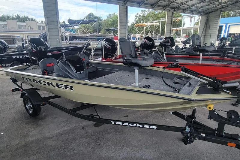 Slide: The Image of 2026 Tracker Pro Team 175 Crappie Edition boat on trailer in showroom. - 2