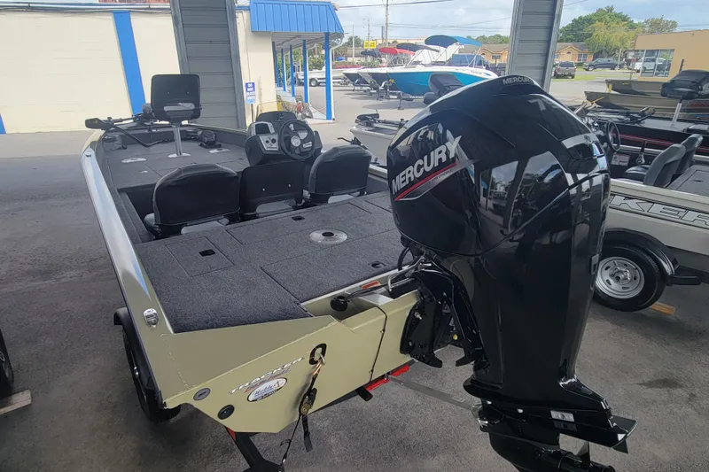 Slide: The Image of 2026 Tracker Pro Team 175 Crappie Edition boat with Mercury engine in showroom. - 3