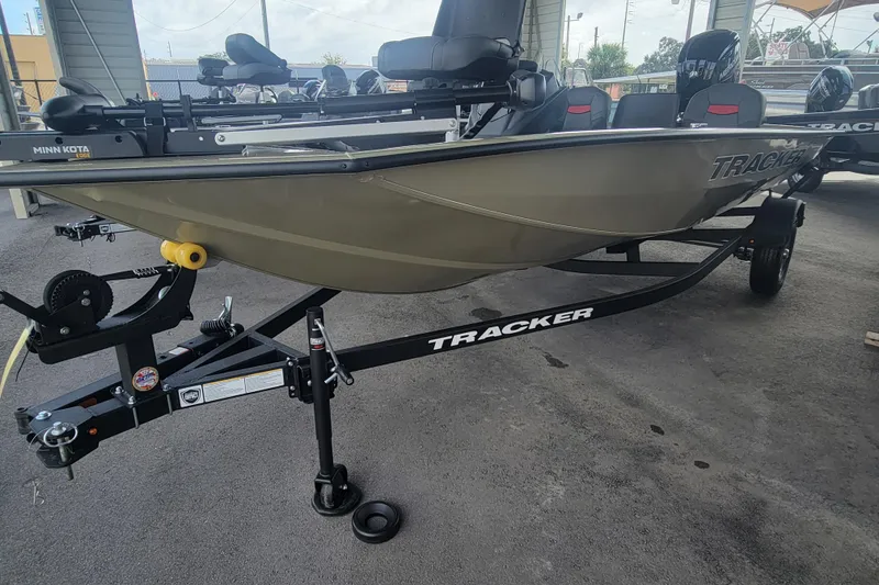 Slide: The Image of 2026 Tracker Pro Team 175 Crappie Edition boat on trailer, parked in a covered area. - 4