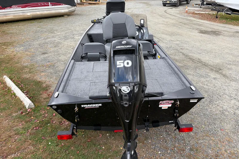 Slide: The Image of 2026 Tracker Bass Tracker Classic XL boat with Mercury 50 engine, parked on gravel. - 59