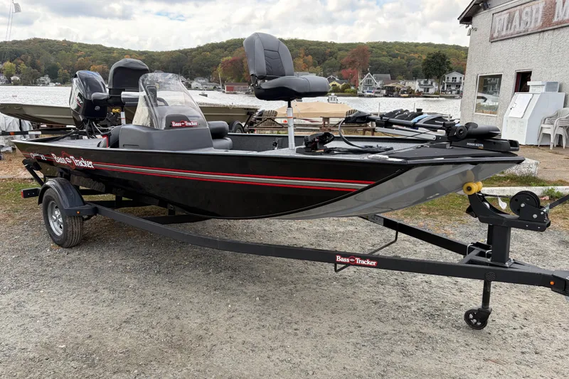 Slide: The Image of 2026 Tracker Bass Tracker Classic XL boat on trailer by lakeside. - 62