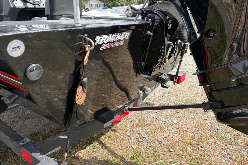Slide: The Image of 2026 Tracker Bass Tracker Classic XL boat rear view with motor and trailer. - 63