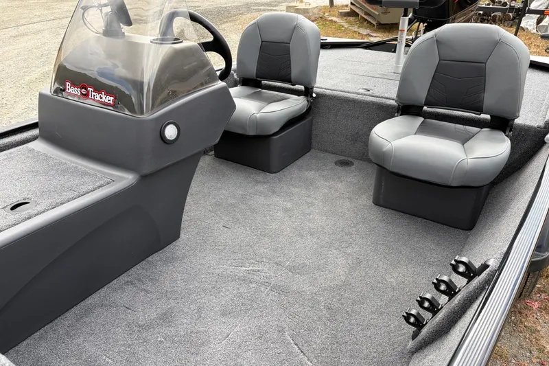 Slide: The Image of 2026 Tracker Bass Tracker Classic XL interior with dual seats and steering console. - 71