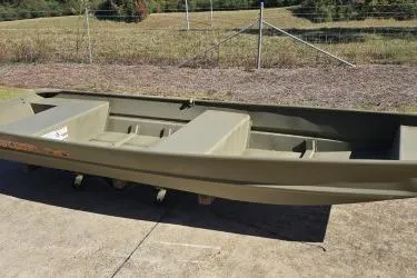 Slide: The Image of 2026 Tracker Grizzly 14 Jon boat on concrete, outdoors. - 3