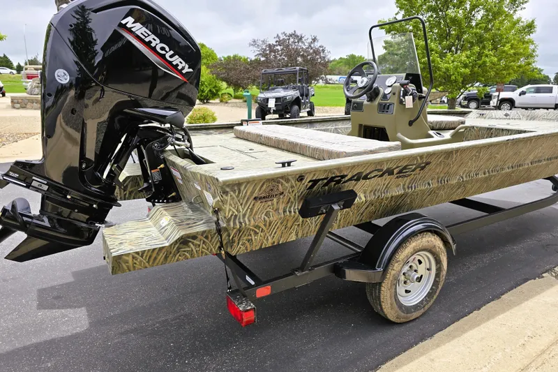 Slide: The Image of 2026 Tracker Grizzly 1860 CC boat with Mercury engine on trailer. - 4