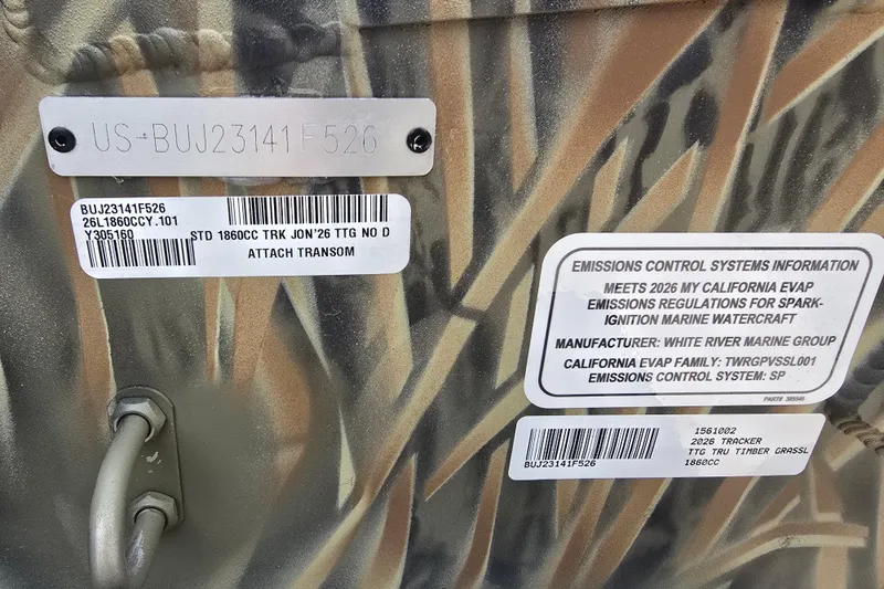 Slide: The Image of 2026 Tracker Grizzly 1860 CC boat with emissions control information and identification labels. - 6