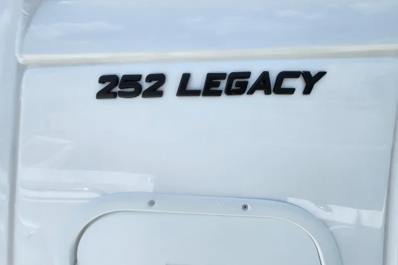 Slide: The Image of 2026 NauticStar 252 Legacy boat model nameplate on white surface. - 8