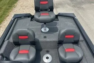 Slide: The Image of 2026 Tracker Pro Team 175 Crappie Edition boat with Lowrance electronics and swivel seat. - 2