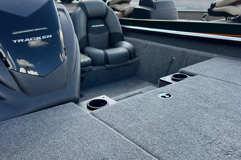 Slide: The Image of 2026 Tracker Pro Team 190 boat interior with cushioned seats and cup holders. - 3