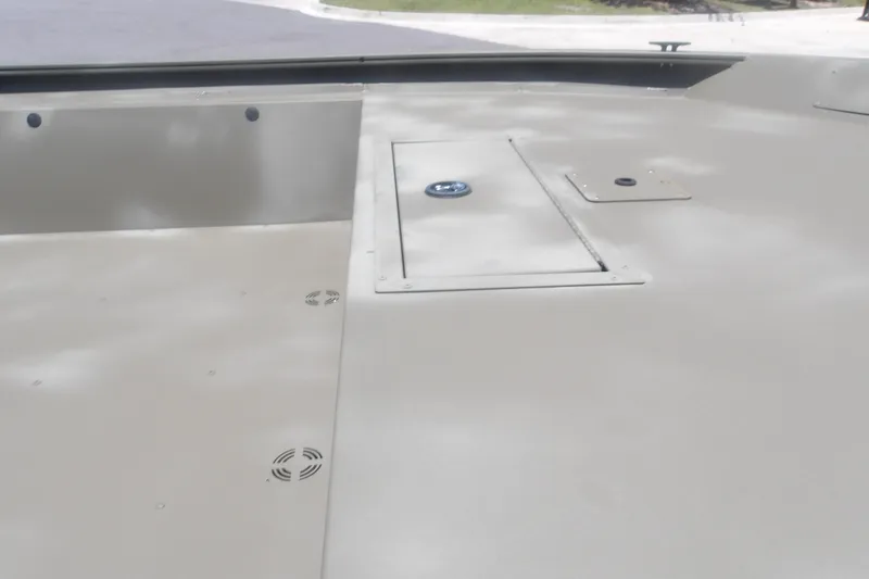 Slide: The Image of 2026 Tracker Grizzly 1860 Utility boat deck with storage compartments. - 5