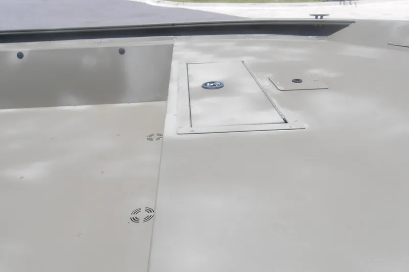 Slide: The Image of 2026 Tracker Grizzly 1860 Utility boat deck with storage compartments and sleek design. - 6
