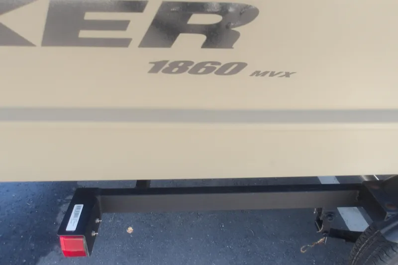 Slide: The Image of 2026 Tracker Grizzly 1860 Utility boat trailer hitch and branding. - 18