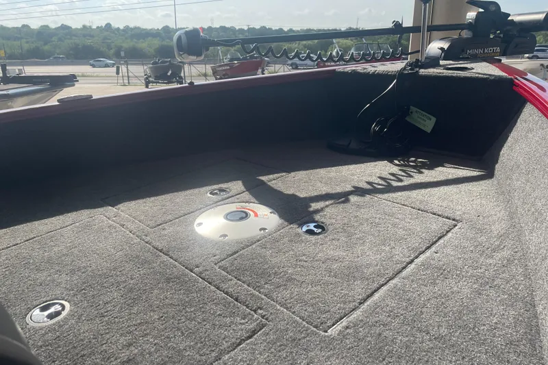 Slide: The Image of 2026 Tracker Super Guide V-16 SC boat interior with Minn Kota trolling motor. - 8