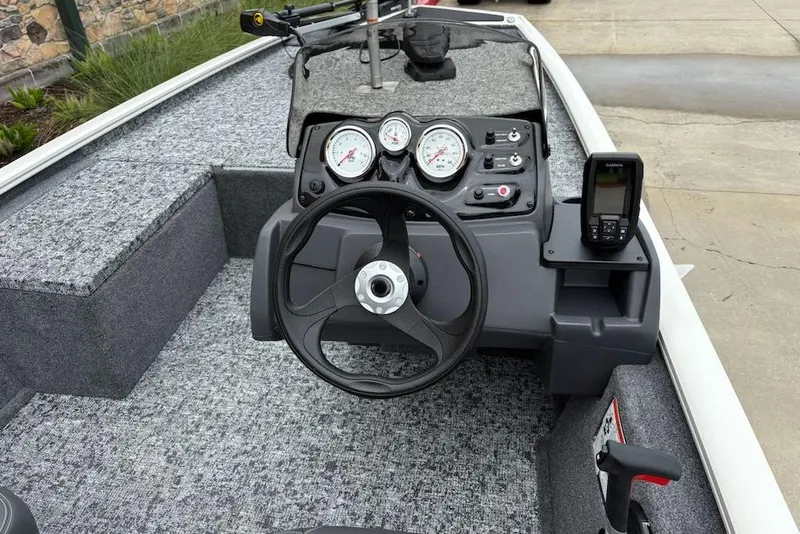 Slide: The Image of 2026 Tracker Pro 170 boat dashboard with steering wheel and gauges. - 6
