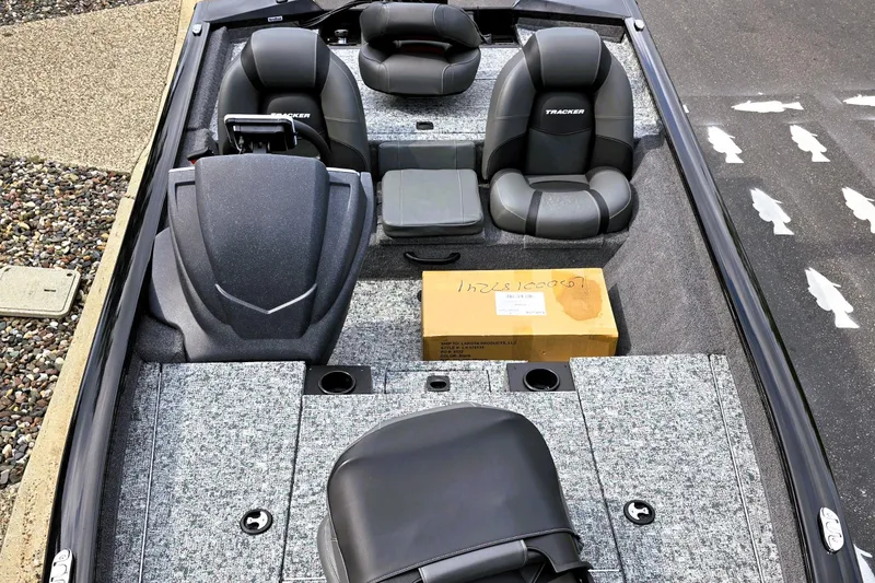 Slide: The Image of 2026 Tracker Pro Team 175 boat interior with seating and storage. - 2