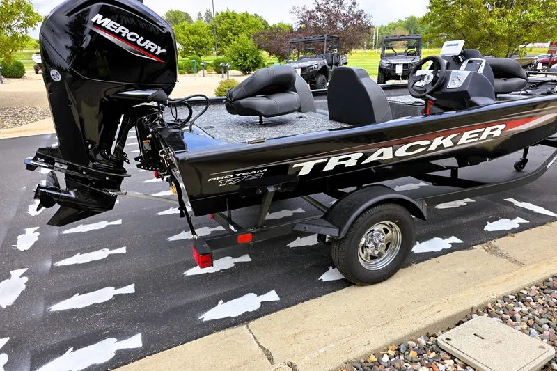 Slide: The Image of 2026 Tracker Pro Team 175 boat with Mercury engine on trailer in parking lot. - 4