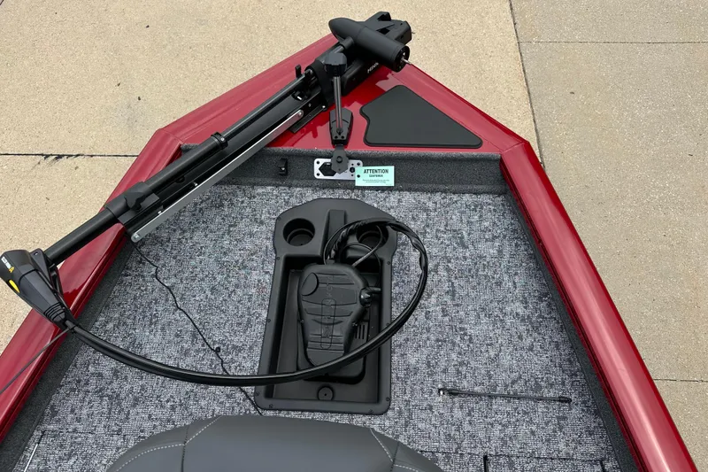 Slide: The Image of 2026 Tracker Pro Team 175 boat with trolling motor and foot pedal on red deck. - 3