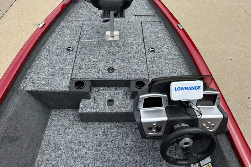Slide: The Image of 2026 Tracker Pro Team 175 boat interior with Lowrance electronics and carpeted deck. - 4