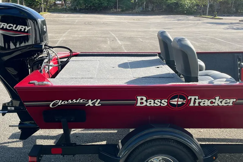 Slide: The Image of 2026 Tracker Bass Tracker Classic XL boat interior with seating and storage compartments. - 11
