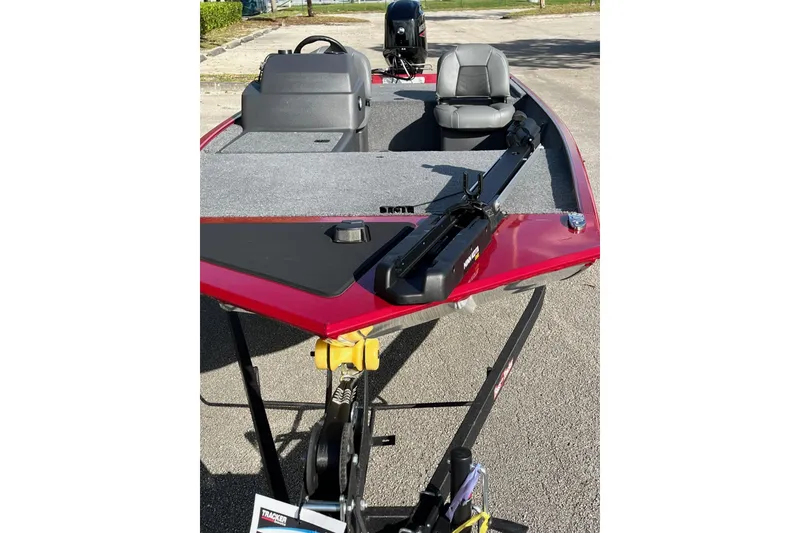 Slide: The Image of 2026 Tracker Bass Tracker Classic XL boat with red exterior and gray interior. - 12