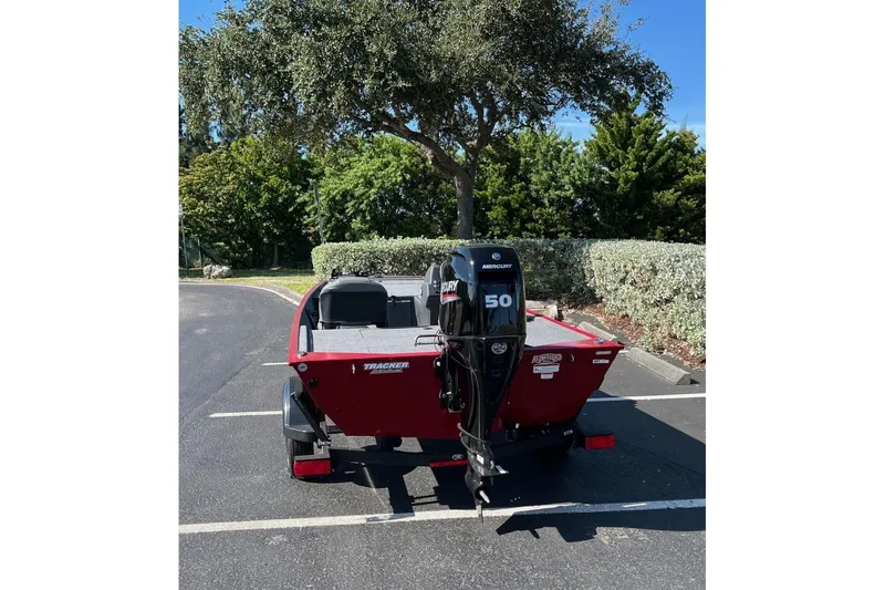 Slide: The Image of 2026 Tracker Bass Tracker Classic XL boat with Mercury 50 engine in parking lot. - 69