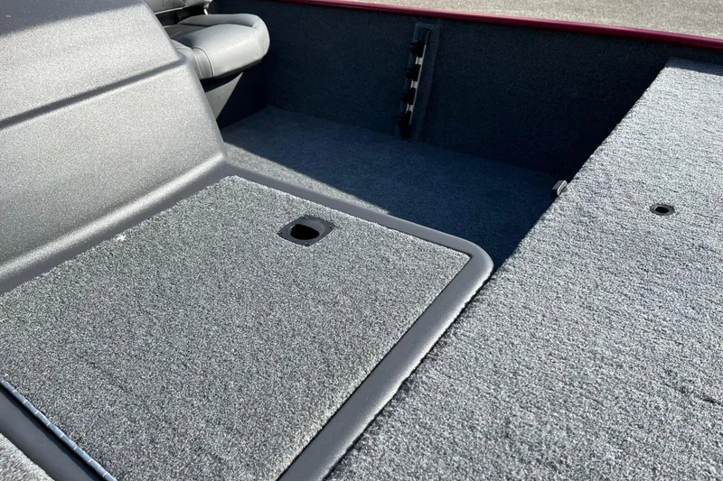 Slide: The Image of 2026 Tracker Bass Tracker Classic XL boat with open storage compartment on deck. - 7