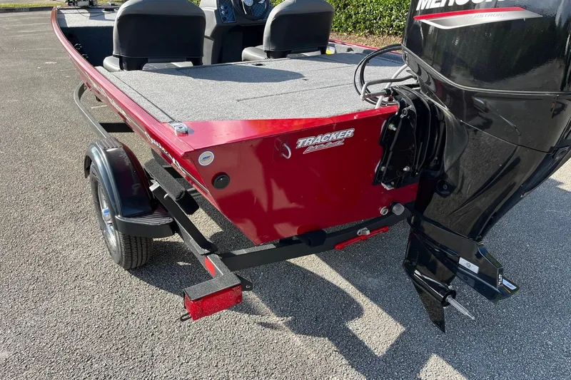 Slide: The Image of 2026 Tracker Bass Tracker Classic XL boat interior with seating and storage compartment. - 8