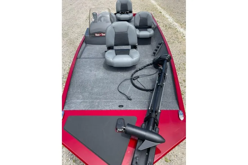 Slide: The Image of 2026 Tracker Bass Tracker Classic XL boat with gray seating and red deck. - 4