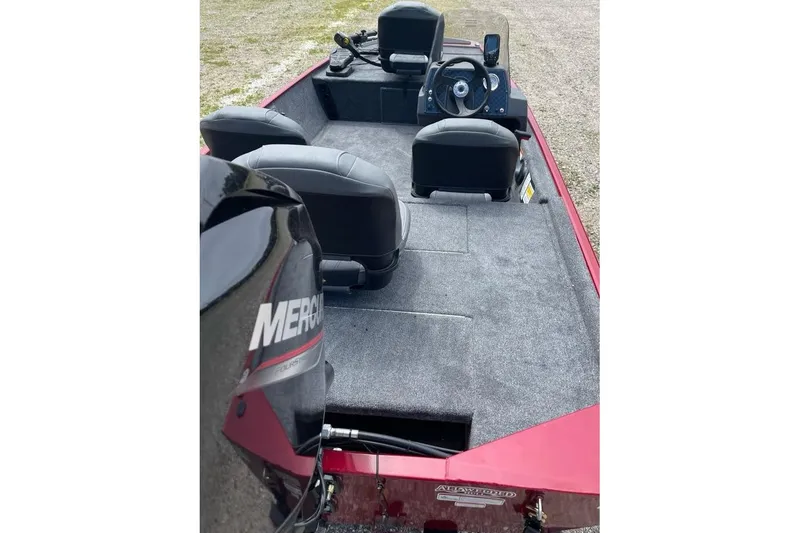 Slide: The Image of 2026 Tracker Bass Tracker Classic XL boat interior with Mercury engine, featuring seating and steering console. - 5
