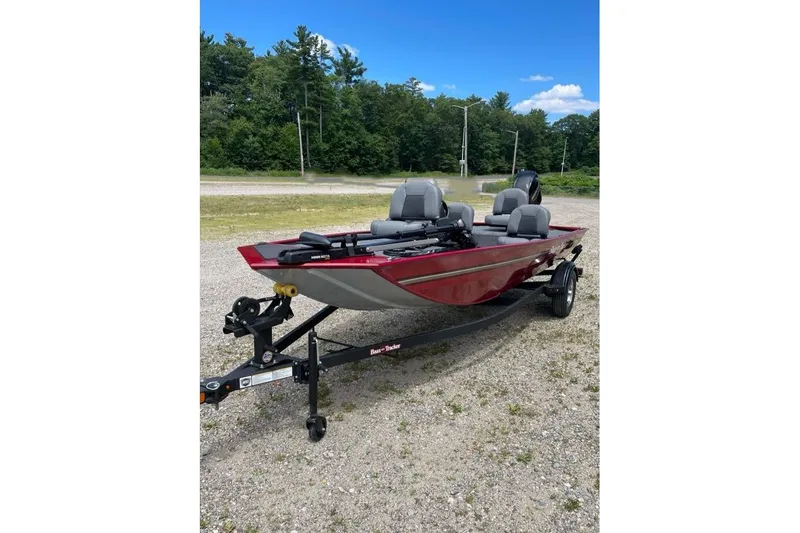Slide: The Image of 2026 Tracker Bass Tracker Classic XL boat on trailer, parked outdoors. - 63