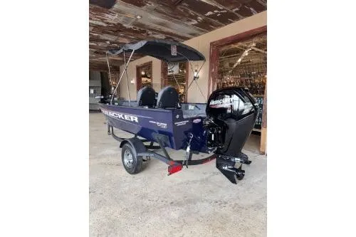 Slide: The Image of 2026 Tracker Pro Guide V-16 SC boat with Mercury outboard motor in a rustic setting. - 9