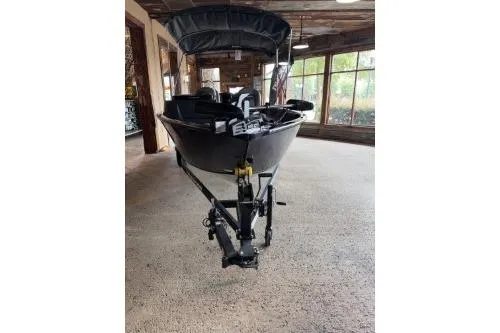Slide: The Image of 2026 Tracker Pro Guide V-16 SC boat displayed indoors on a trailer. - 10