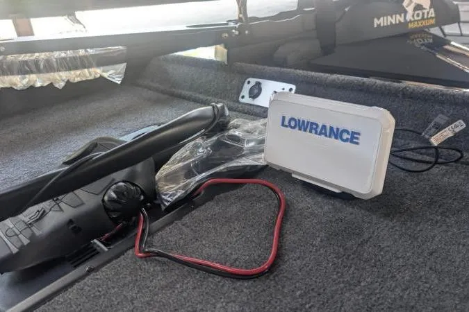 Slide: The Image of 2026 Tracker Pro Team 190 boat interior with Lowrance device and Minn Kota trolling motor. - 4