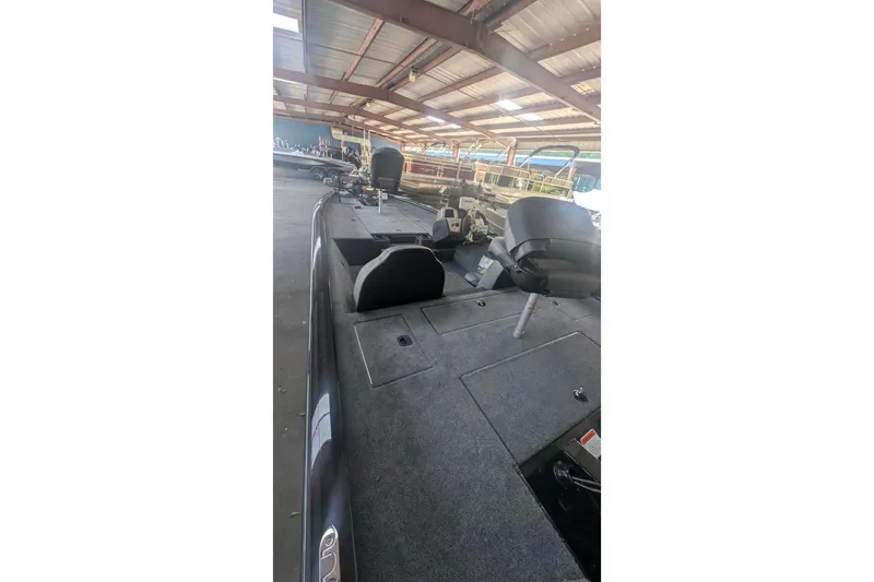 Slide: The Image of 2026 Tracker Pro Team 190 boat interior in a covered storage area. - 7