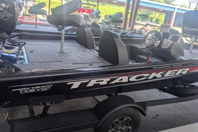 Slide: The Image of 2026 Tracker Pro Team 190 boat on trailer, featuring spacious seating and modern design. - 8