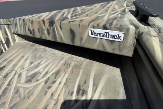 Slide: The Image of 2026 Tracker Grizzly 1860 Utility boat with camo pattern and VersaTrack system. - 4