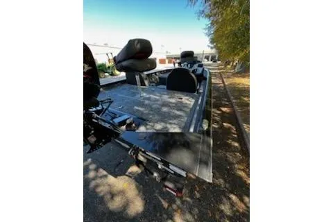 Slide: The Image of 2026 Tracker Pro Team 175 boat parked outdoors, featuring seating and equipment. - 4