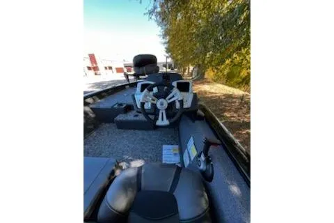 Slide: The Image of 2026 Tracker Pro Team 175 boat interior with steering wheel and seating. - 5