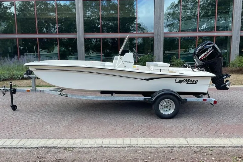 The Image of 2026 Mako Pro Skiff 15 CC boat on trailer, parked outdoors. - 0