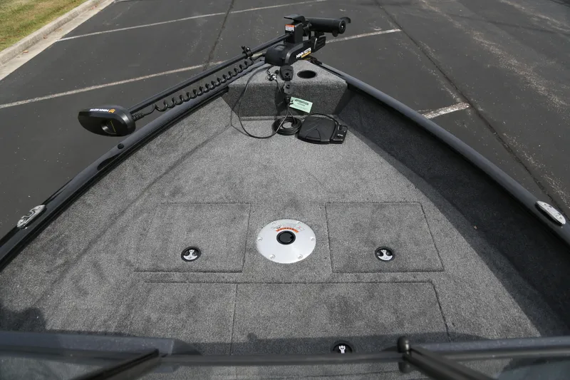 Slide: The Image of 2026 Tracker Pro Guide V-16 WT boat deck with trolling motor and storage compartments. - 2